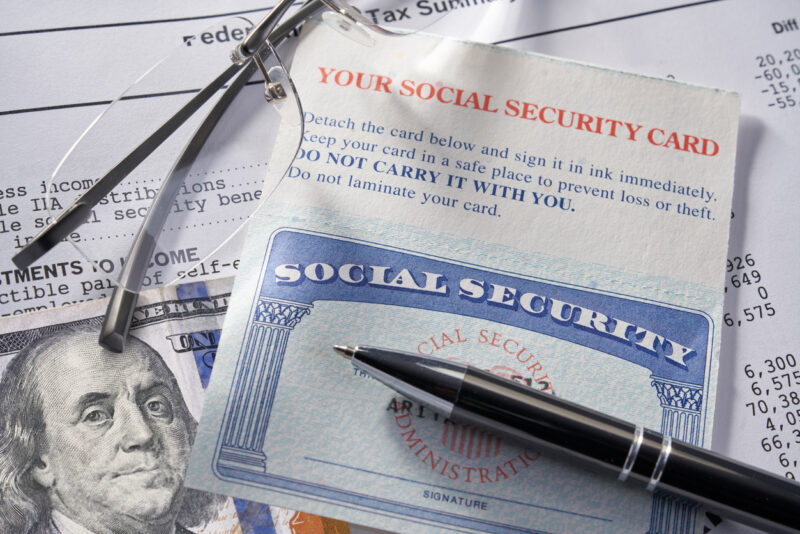 Social Security Card with calculator and money